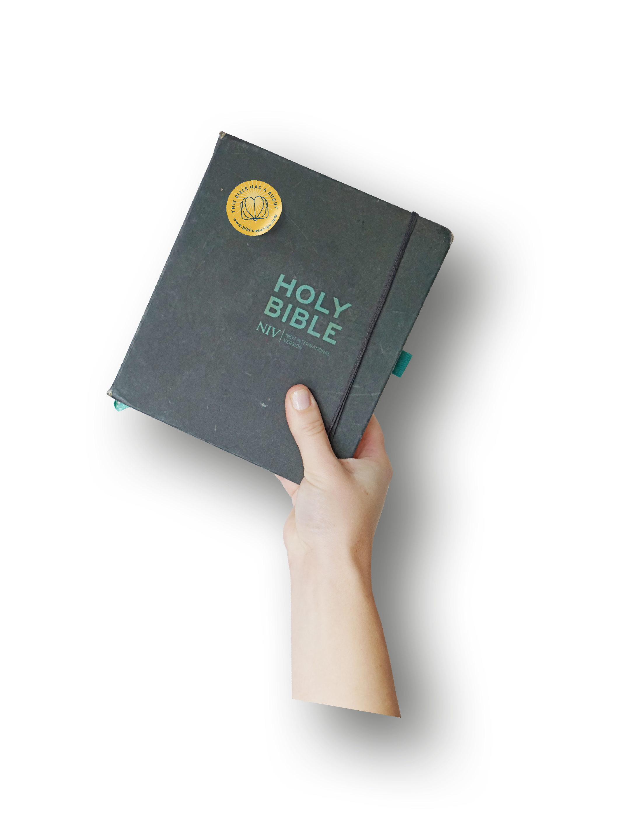 Hand holding up a Bible with the Bible Buddy Sticker on it